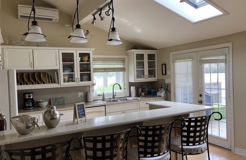 Halifax County House | Tranquil Lakefront Retreat with Spa and Ocean Views
