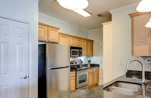 Charleston Condo | Peaceful condo with pool, W/D, balcony, TV, deck, & kitchen - close to beach