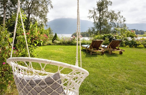 Glomset Apartment | Peaceful countryside apartment near Ålesund. Fjord & Mountain views & garden