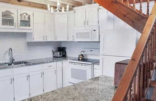 Joly Cottage | Tranquil Lakefront Cottage: Pet Friendly & Pool Access