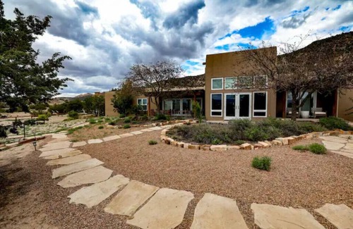 Ojo Caliente Apartment | Serene Black Mesa King Room - Pet Friendly & Family Ready