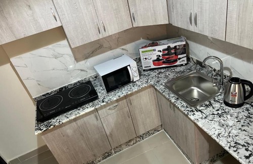 Doha Apartment | Discover Pearl One: Family-Friendly with Kitchen Access