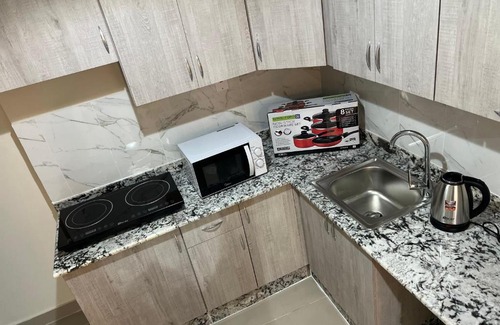 Doha Apartment | Discover Pearl One: Family-Friendly with Kitchen Access