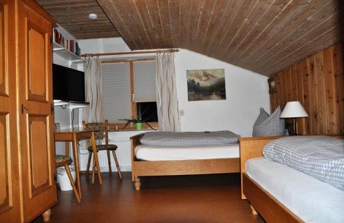 Lechbruck Hotel | Welcoming Pension Hirsch: Poolside Relaxation Awaits