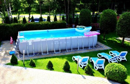 Mikolajki Resort | Relaxing Oceanfront Retreat with Pool and Hot Tub