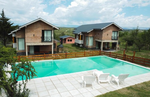 Villa General Belgrano House | Idyllic Pentagrama: Oceanfront Retreat with Pool & Views