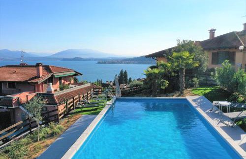 Meina Apartment | Experience Penthouse Andrea: Oceanfront Escape with Pool