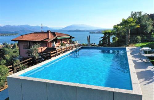 Meina Apartment | Experience Penthouse Andrea: Oceanfront Escape with Pool