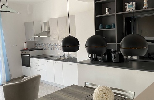 Zambrone Apartment | Elegant Penthouse Apartment with Private Rooftop Solarium