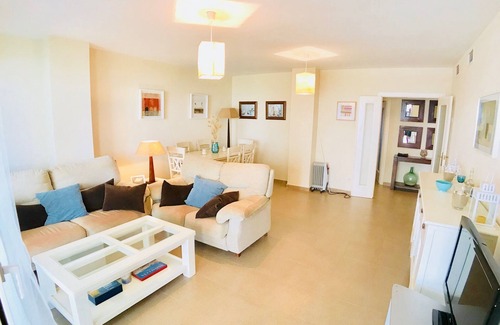 Punta del Moral Apartment | Inviting Penthouse in Isla Canela with Pool & Sea Views