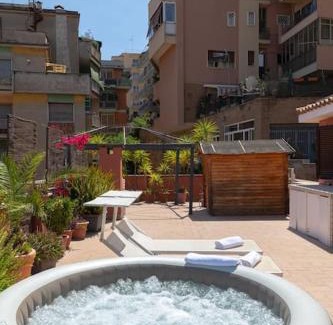 Gianicolense Apartment | Indulgent Penthouse with Jacuzzi and Private Terrace in Trastevere