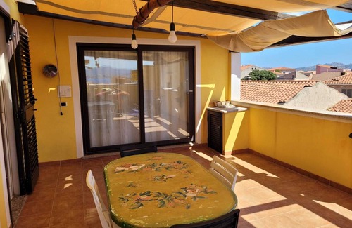 La Maddalena Apartment | Elegant Penthouse with Terrace, Steps from Palau Center
