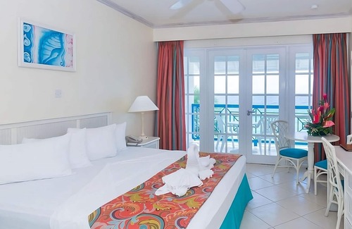 St. Lawrence Gap Hotel | Beachfront Escape in Barbados: Pool, Kitchenette & Balcony