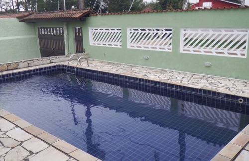 Jardim Santa Tereza House | Inviting Retreat with Pool, BBQ & Steps from the Beach