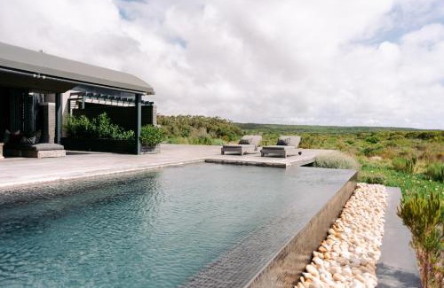 Stanford Villa | Discover Perivoli Lagoon House: Ocean View & Poolside Bliss
