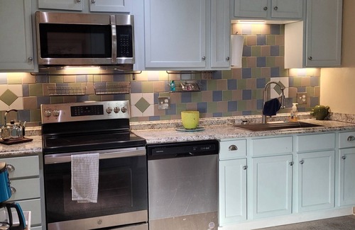 Edgewater House | Pet-Friendly Riverwalk Cottage with Pool Access & Spa