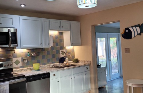 Edgewater House | Pet-Friendly Riverwalk Cottage with Pool Access & Spa