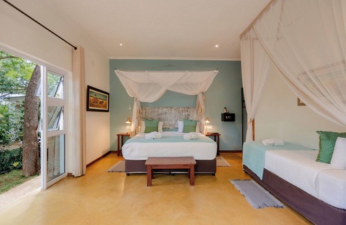 Victoria Falls Cabin | Exceptional PheZulu Guest Lodge: Top-Rated with Pool & Dining