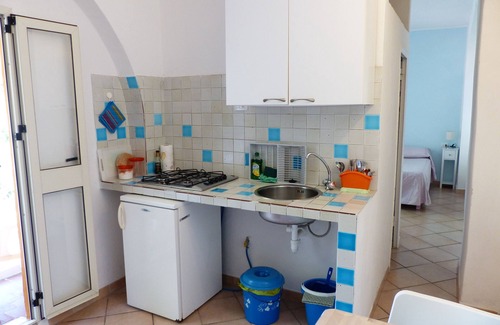 Santa Teresa di Gallura Apartment | Cozy Flat with Balcony Overlooking the Garden & Ocean View
