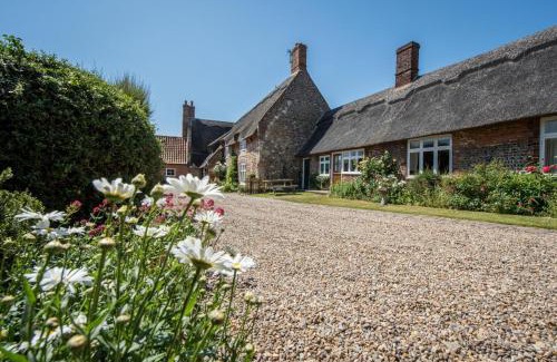 Bacton House | Discover Pilgrims Cottage: Pet-Friendly Retreat with Pool