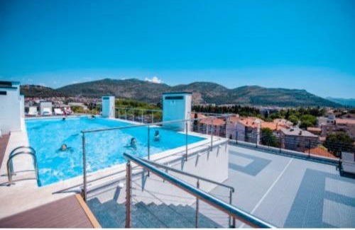 Trebinje Apartment | Prime Pine 1 Apartment: Oceanfront Stay with Pool Access