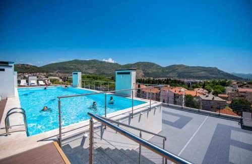 Trebinje Apartment | Central Pine 2 Apartment: Top-Rated with Pool Access