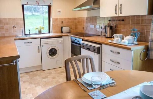 Dingwall Cottage | Family-Friendly Pine Lodge with Garden in Culbokie