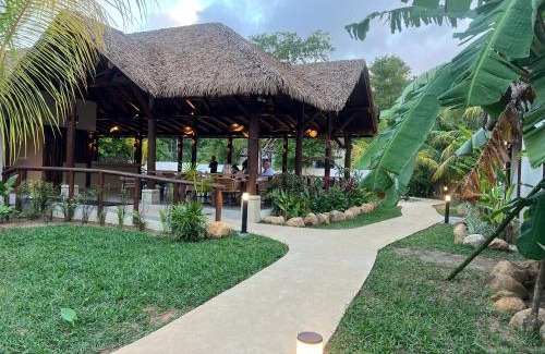 Mahe Island Apartment | Pineapple Beach Villas: Oceanfront Retreat with Pool