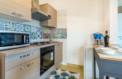 Torre Lapillo Villa | Pink Cottage: Cozy Studio with Pool & Garden Oasis
