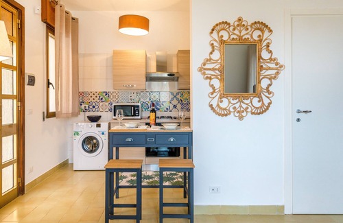 Torre Lapillo Villa | Pink Cottage: Cozy Studio with Pool & Garden Oasis