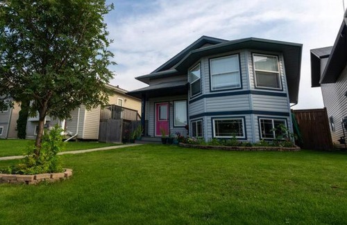 Grande Prairie House | Enchanting Pink Door Hotel - Perfect for Families