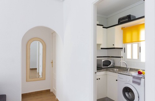 La Siesta Apartment | Inviting Pink Summer Apartment with Oceanfront Amenities