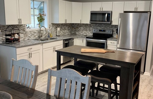 Normandy Shores House | Pirate's Retreat - Renovated Lake Home with Dock & Pool