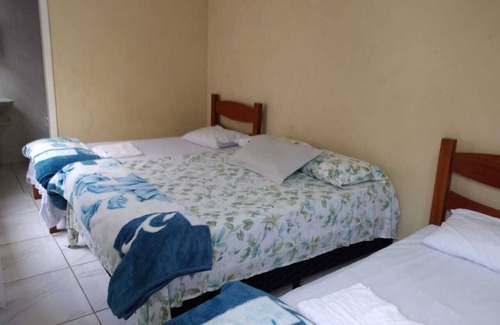Itanhaem House | Cozy 6-Bedroom Retreat with Ocean View & BBQ Area