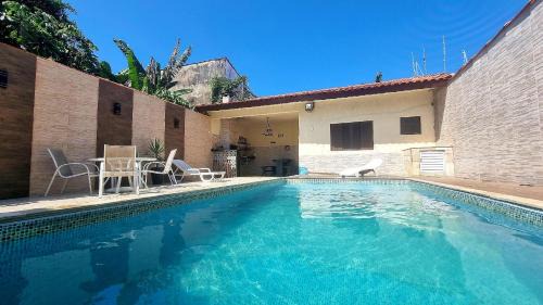 Tupy House | Relax at Our 4-Star Hotel with Heated Pool & Wi-Fi