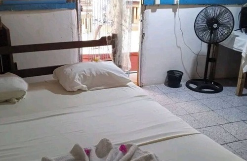 Ambaro House | Discover Piscine Bimoko: Family-Friendly with Pool & Dining