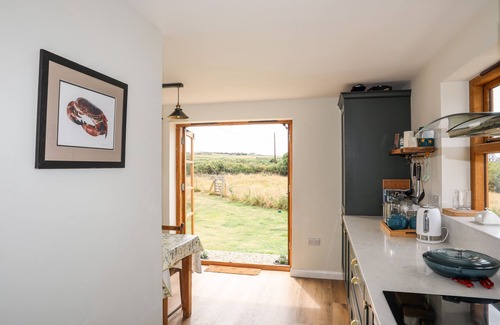 Rhoscolyn Cottage | Cozy Retreat at Plas Coch Rhoscolyn - Pet Friendly Oasis