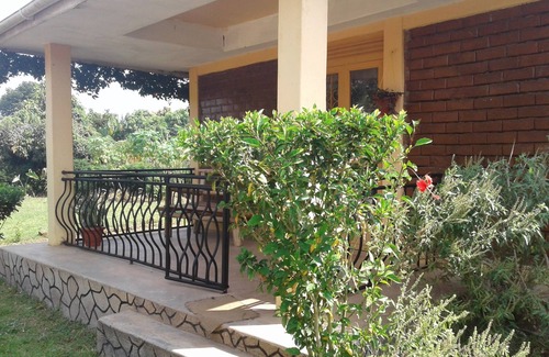 Entebbe House | Relax at the Unique Plastic Bottles House with Ocean Views