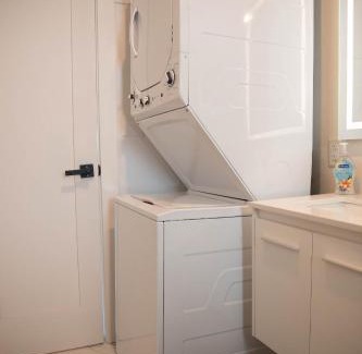 Peak's Suburban Addition Apartment | Contemporary Chrome Escape: Family-Friendly Stay Awaits