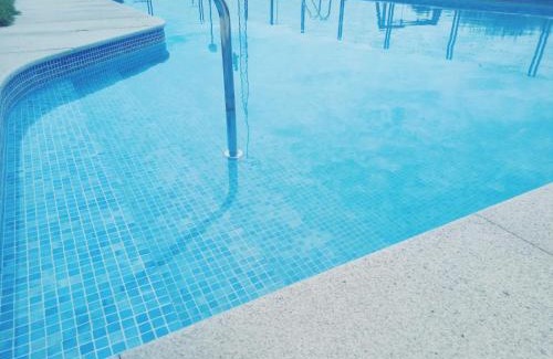 Sanxenxo Apartment | Relax at Playa Areas: Oceanfront Family Retreat with Pool