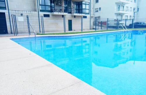 Sanxenxo Apartment | Relax at Playa Areas: Oceanfront Family Retreat with Pool
