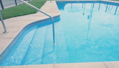 Sanxenxo Apartment | Relax at Playa Areas: Oceanfront Family Retreat with Pool