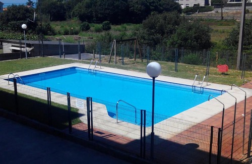 Sanxenxo Apartment | Relax at Playa Areas: Oceanfront Family Retreat with Pool