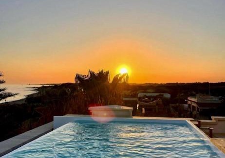 Marina di Lizzano Bed & Breakfast | Elegant Playa Paraiso: Oceanfront Retreat with Pool Access
