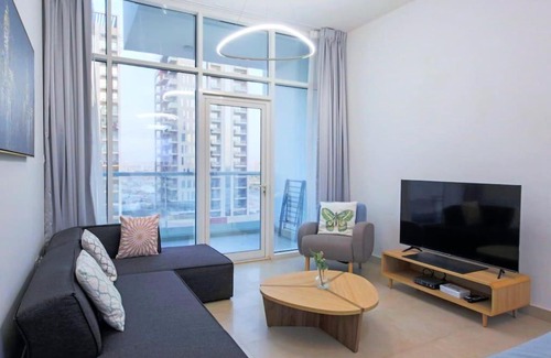 Dubai Apartment | Modern Retreat: Vibrant 1 BR Home in Furjan with Pool