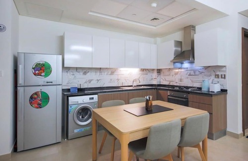Dubai Apartment | Modern Retreat: Vibrant 1 BR Home in Furjan with Pool