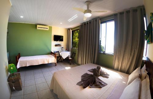 Ilha Grande House | Cozy Ponta Da Barca: Oceanfront Retreat with Spa & Dining