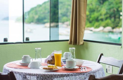 Ilha Grande House | Cozy Ponta Da Barca: Oceanfront Retreat with Spa & Dining