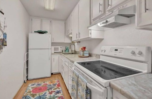 Racquet Club West Condo | Serene Poolside Retreat Ideal for Families and Relaxation