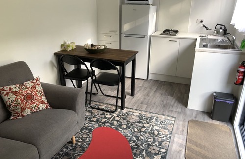 Whangarei Heads Cabin | Discover Urquharts Bay: Beach Cabin with Private Garden